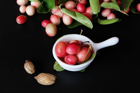 Karonda fruit is delicious on black backgroundの写真素材