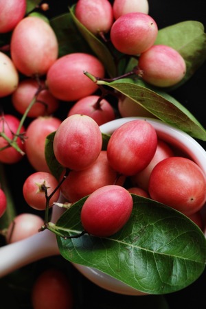 Karonda fruit is delicious on black backgroundの写真素材