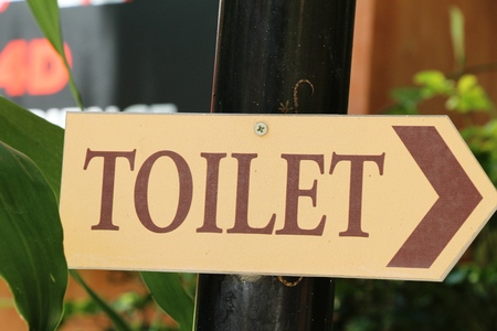 Symbolize arrow pointing go to way toiletの写真素材