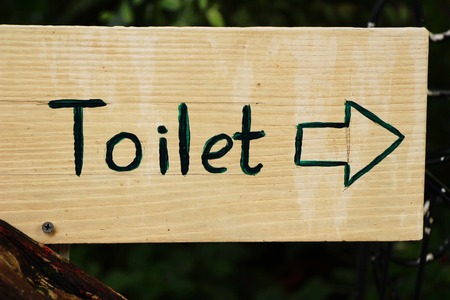 Symbolize arrow pointing go to way toiletの写真素材