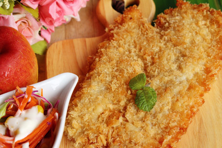 Fried dory fish with vegetable salad delicious