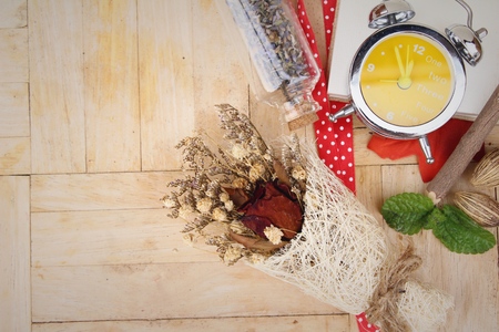 Dried rose flower with clock vintage styleの写真素材