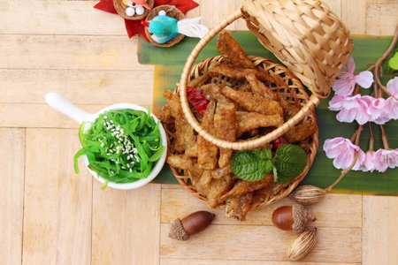 Seaweed salad with fried fish is deliciousの写真素材