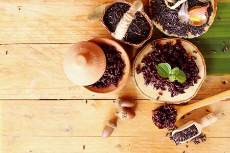 Cook black rice and raw organic riceberry riceの写真素材