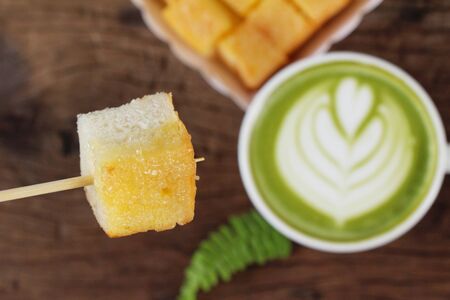 Hot green tea with matcha and toastの写真素材