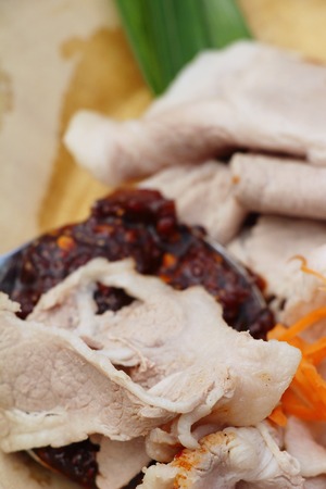 Boiled pork with spicy sauce is deliciousの写真素材