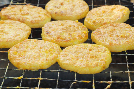 Grilled sticky rice with egg plating on stove