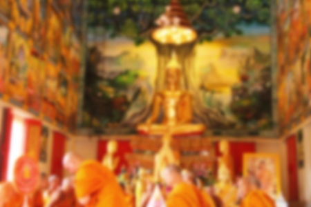 Blurred many buddhist monk in thai templeの写真素材