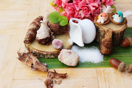 Boiled taro with sugar on wood backgroundの写真素材