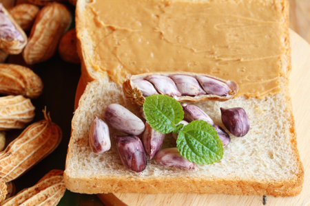 Creamy peanut butter smeared on bread delicious
