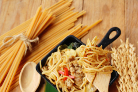 Stir fried spicy spaghetti with pork delicious