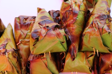 grilled sticky rice on stove in marketの写真素材