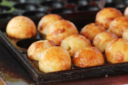 Takoyaki is delicious Japanese food on panの写真素材
