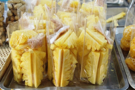 Fresh pineapple is delicious in street foodの写真素材