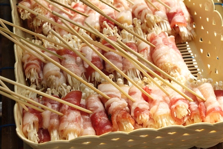 Bacon wrapped mushrooms delicious at street foodの写真素材