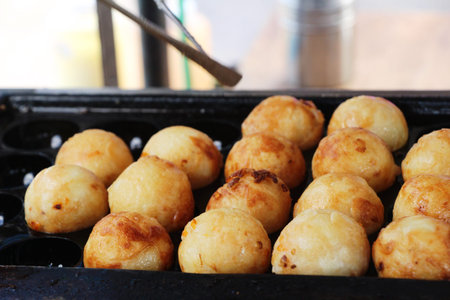 Takoyaki is delicious Japanese food on pan
