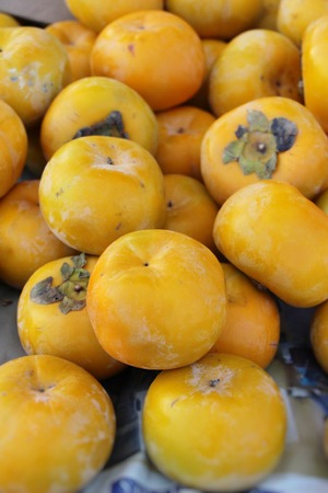 Persimmon fruit is delicious at street foodの写真素材