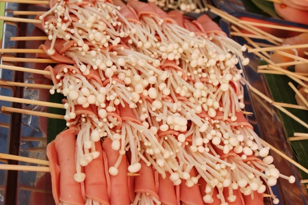 Bacon wrapped mushrooms delicious at street foodの写真素材