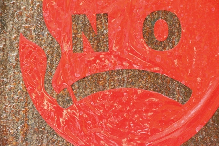 No smoking sign on the wall backgroundの写真素材