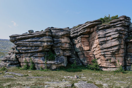 Low syenite rock igneous mountain formation. cooled layers of magma. Climbing training areaの写真素材