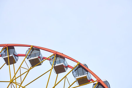 Ferris wheel cabins in the amusement park with copy space