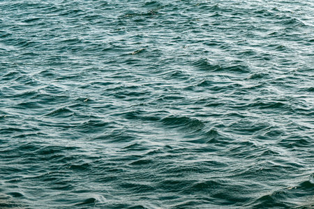 Ripple water surface, green color natural background, oceanの写真素材
