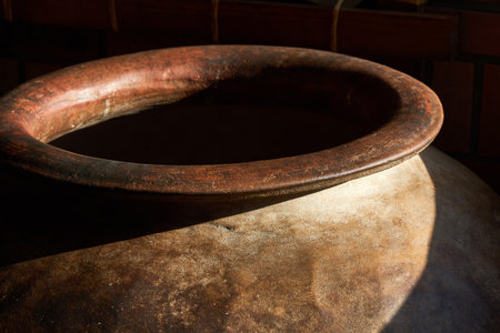 Ancient large clay pot, ceramic vase with wide neck closeupの写真素材