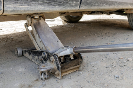 Tire fitting process, trolley jack lifts the car.の写真素材