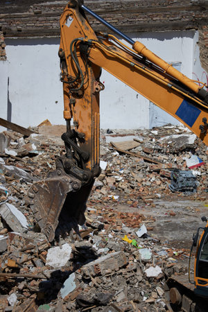 excavator bucket on dismantling site, side view.