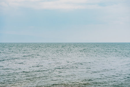 Sea, sky and horizon. Water with ripple, soft color backdrop.の写真素材