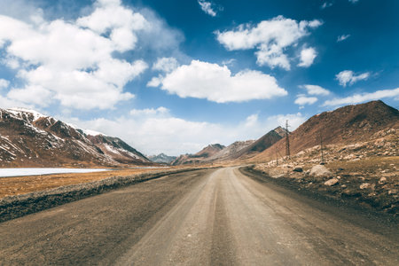 Ideal gravel road in the highlands, mountainous natural landscape.の写真素材