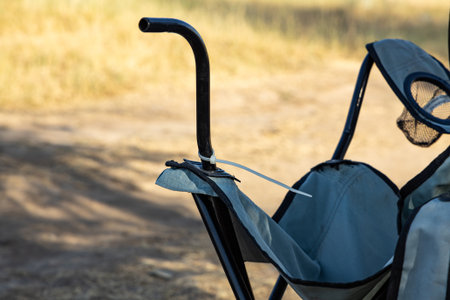 Broken camping chair. Damaged outdoor furniture.の写真素材