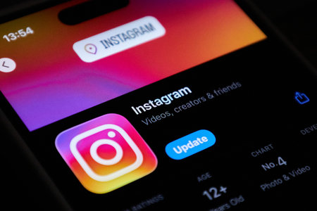 Instagram social network mobile app with update button in the App store on iPhone. Bishkek,...