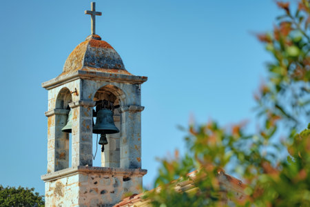 Church bell tower against blue skyの素材