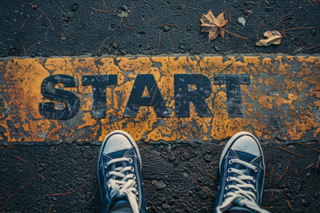 feet on the road in front of the word start, goal achievement conceptの素材