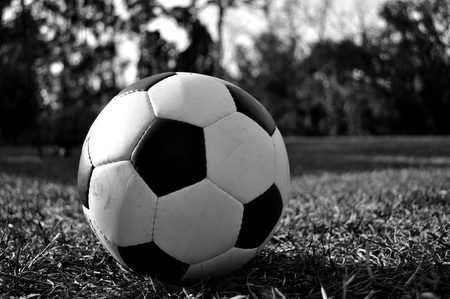 A black and white image of a soccer ball in the backyard.の写真素材