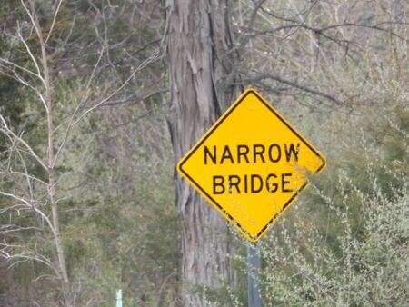 Narrow bridge signの写真素材