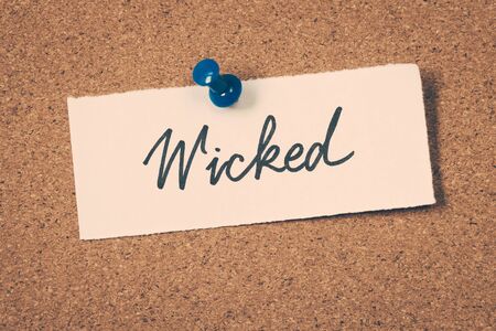 wicked word on noteの写真素材