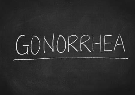 gonorrhea concept word on a blackboard backgroundの写真素材