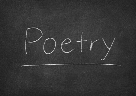 poetry concept word on a chalkboard backgroundの写真素材