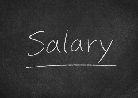 salary concept word on a blackboard backgroundの写真素材