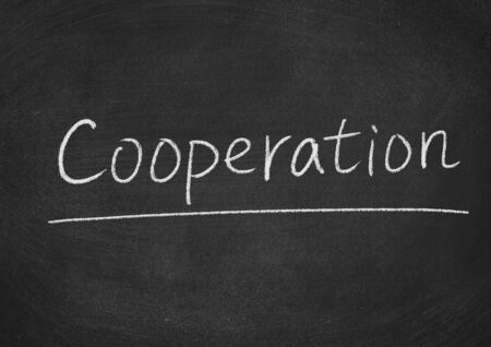 cooperation concept word on a blackboard backgroundの写真素材