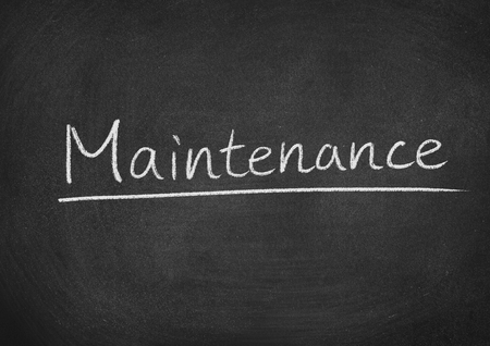maintenance concept word on a blackboard backgroundの写真素材