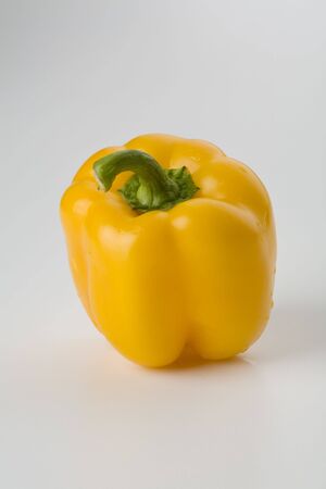 Yellow bell pepper isolated on white verticalの写真素材