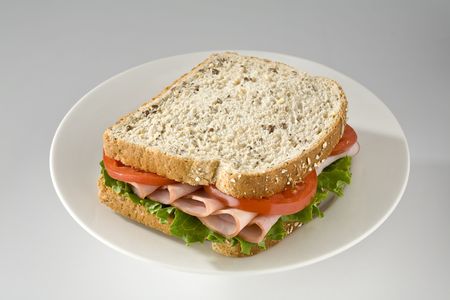Ham and tomato sandwich on wholegrain breadの写真素材