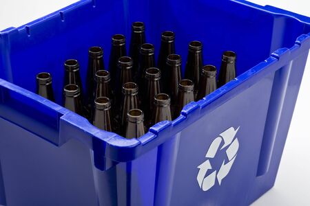 Blue box with recycle symbol and empty bottlesの写真素材