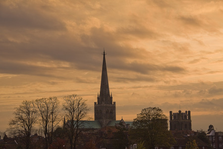 Cathedral silhouetted against sunsetの写真素材
