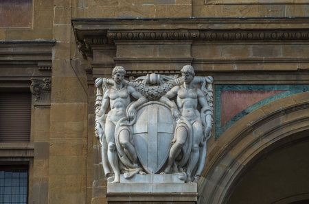 pair of white statues at side of historic archway entranceの写真素材