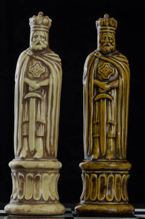 chess pieces arranged in striking patterns on chess boardの写真素材