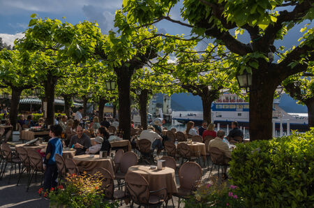 Lake Como in Italy beautiful scenery surrounded by snow capped mountains and lush Forrest.のeditorial素材